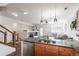Open-concept living room featuring a fireplace and stylish decor at 4100 Albion St # 205, Denver, CO 80216