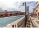 Exterior view of an outdoor community pool and landscaping at 4100 Albion St # 205, Denver, CO 80216