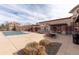Inviting pool area with a nearby building and outdoor seating for residents' relaxation and enjoyment at 4100 Albion St # 205, Denver, CO 80216