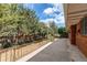 Spacious patio with railing overlooks the backyard and provides an area for relaxation at 2081 W Ridge Rd, Littleton, CO 80120