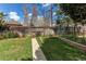 Fenced backyard with a walkway to a small garden area great for relaxing at 2081 W Ridge Rd, Littleton, CO 80120