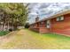 Brick ranch-style house with large backyard and mature trees offering a comfortable outdoor space at 2081 W Ridge Rd, Littleton, CO 80120