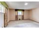Bright bedroom features neutral carpet, closet, and windows with decorative valances at 2081 W Ridge Rd, Littleton, CO 80120