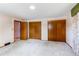 Bright bedroom with neutral carpet and spacious closet at 2081 W Ridge Rd, Littleton, CO 80120