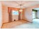 Light-filled dining area with pink walls, carpet, and a decorative chandelier at 2081 W Ridge Rd, Littleton, CO 80120