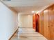 Hallway view showcasing a retro tile floor and built-in wooden storage at 2081 W Ridge Rd, Littleton, CO 80120