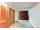 Hallway with light tile floors and wooden closets offering ample storage space at 2081 W Ridge Rd, Littleton, CO 80120