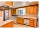 Spacious kitchen includes a window overlooking yard, and built-in dishwasher at 2081 W Ridge Rd, Littleton, CO 80120