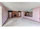 Large living room showing fireplace, pink walls, and mirror wall at 2081 W Ridge Rd, Littleton, CO 80120