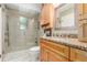 Updated bathroom featuring granite counters and a glass enclosed shower at 1080 Tantra Park Cir, Boulder, CO 80305