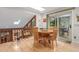 Cozy dining area with skylight, hardwood floors, and sliding glass doors to the outside at 1080 Tantra Park Cir, Boulder, CO 80305