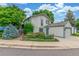 Two-story home with a detached garage and established landscaping at 1080 Tantra Park Cir, Boulder, CO 80305