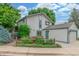 Two-story home with a detached garage and colorful landscaped yard at 1080 Tantra Park Cir, Boulder, CO 80305