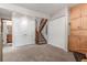 Hallway leading to a staircase, several closets and another room at 1080 Tantra Park Cir, Boulder, CO 80305