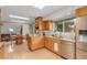 Open kitchen with skylights, stainless steel appliances, granite counters, and hardwood floors at 1080 Tantra Park Cir, Boulder, CO 80305