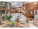 Inviting living room features a loft, skylights, hardwood floors, and wood accent walls at 1080 Tantra Park Cir, Boulder, CO 80305