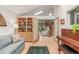Spacious living room featuring a piano, built-in bookshelf, and hardwood floors at 1080 Tantra Park Cir, Boulder, CO 80305