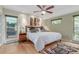 Spacious bedroom featuring hardwood floors, neutral wall color and ceiling fan at 1080 Tantra Park Cir, Boulder, CO 80305