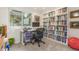 Well-lit office featuring a large bookcase and comfortable workspace at 1080 Tantra Park Cir, Boulder, CO 80305