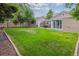 Well-maintained backyard with a green lawn and a view of the house exterior at 962 Uvalda St, Aurora, CO 80011
