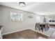 Bright dining room with wood floors, neutral paint and large windows at 962 Uvalda St, Aurora, CO 80011