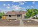 Charming single-story home featuring a well-maintained lawn and a welcoming entrance at 962 Uvalda St, Aurora, CO 80011