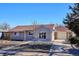 Charming single-Gathering home features a paved driveway and a cozy, well-maintained yard at 962 Uvalda St, Aurora, CO 80011