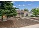 Charming single-story home with well-maintained landscaping, trees, and inviting curb appeal at 962 Uvalda St, Aurora, CO 80011