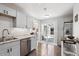 Modern kitchen with stainless steel appliances and sliding door to the patio at 962 Uvalda St, Aurora, CO 80011