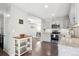 Updated kitchen with stainless steel appliances and view to dining area at 962 Uvalda St, Aurora, CO 80011