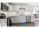 Modern kitchen featuring stainless steel appliances and sleek countertops at 962 Uvalda St, Aurora, CO 80011