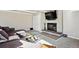 The living room is complete with a TV and cozy fireplace at 962 Uvalda St, Aurora, CO 80011