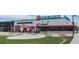 Exterior view of modern marketplace, with a large building with inviting outdoor seating at 962 Uvalda St, Aurora, CO 80011