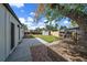 Fenced backyard featuring a lawn, storage shed and concrete patio, perfect for outdoor entertaining at 1360 S Forest Way, Denver, CO 80222