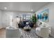 Inviting living room with a large window, plants, and modern decor offering a comfortable, relaxing ambiance at 1360 S Forest Way, Denver, CO 80222