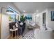 Inviting living room with a large window, plants, and modern decor offering a comfortable, relaxing ambiance at 1360 S Forest Way, Denver, CO 80222