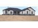 Beautiful single-story home featuring gray stone accents and a charming covered entryway at 62101 E 32Nd Ct, Strasburg, CO 80136