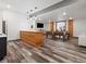 Basement game room with stylish wood finishes and a classic billiard table for entertainment at 62101 E 32Nd Ct, Strasburg, CO 80136