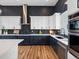 The kitchen features modern cabinetry, countertops, and stainless steel appliances at 62101 E 32Nd Ct, Strasburg, CO 80136