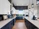 Well-equipped kitchen with sleek countertops, modern appliances, and ample cabinet space at 62101 E 32Nd Ct, Strasburg, CO 80136