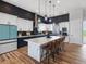 Modern kitchen features a large island, stainless steel appliances, and stylish pendant lighting at 62101 E 32Nd Ct, Strasburg, CO 80136
