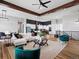 Expansive living room with open layout, modern finishes, and comfortable furnishings at 62101 E 32Nd Ct, Strasburg, CO 80136