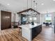 Spacious kitchen open to the living and dining areas, great for entertaining and modern living at 62101 E 32Nd Ct, Strasburg, CO 80136