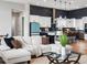Comfortable living room showcasing an open floor plan to the modern kitchen and eating area at 62101 E 32Nd Ct, Strasburg, CO 80136
