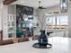 Bright living space with fireplace and built-in shelving, complemented by a stylish decor and furniture at 62101 E 32Nd Ct, Strasburg, CO 80136