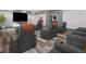 Home theater room featuring comfortable seating, projector, and immersive viewing experience at 62101 E 32Nd Ct, Strasburg, CO 80136