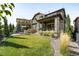 This backyard features a patio, a fire pit, and a lush lawn at 6938 E Lake Dr, Centennial, CO 80111