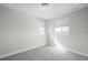 This bedroom features neutral walls, carpet, and two windows at 6938 E Lake Dr, Centennial, CO 80111