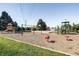 Community playground featuring swings, slides, and other play equipment for children at 6938 E Lake Dr, Centennial, CO 80111