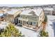 Two-story home with backyard deck and snowy landscape at 2229 Candleglow St, Castle Rock, CO 80109